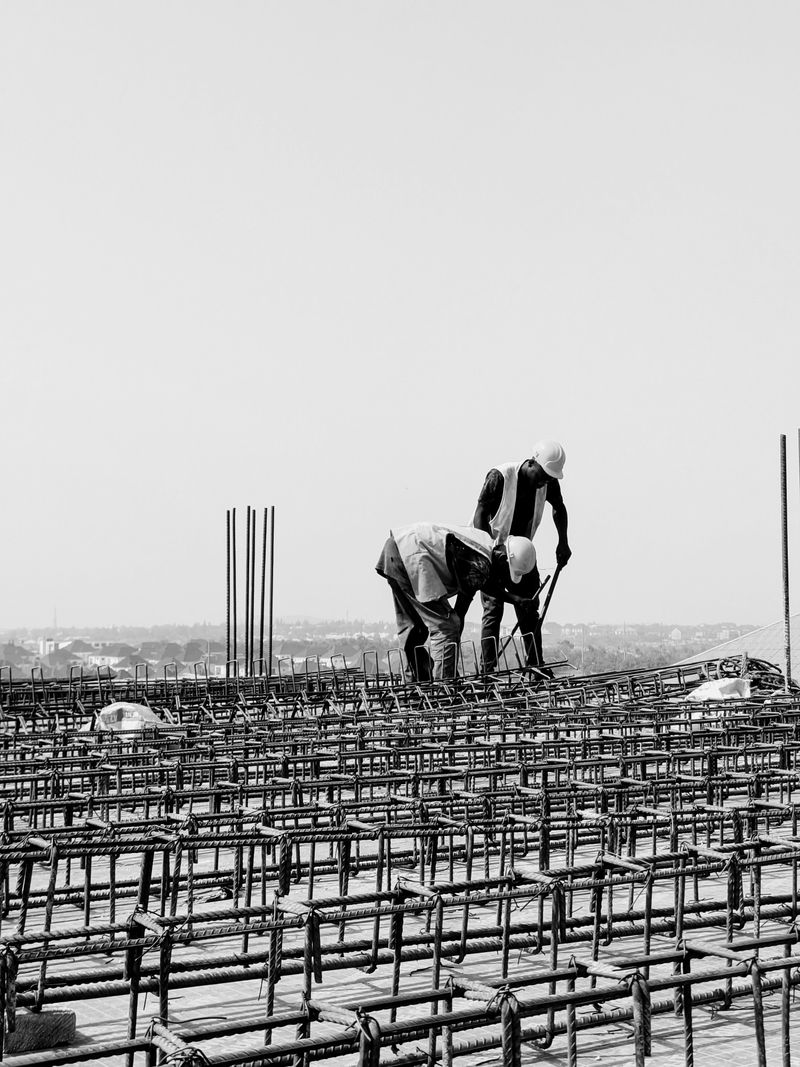 Workers on a rebar mat at a building construction site